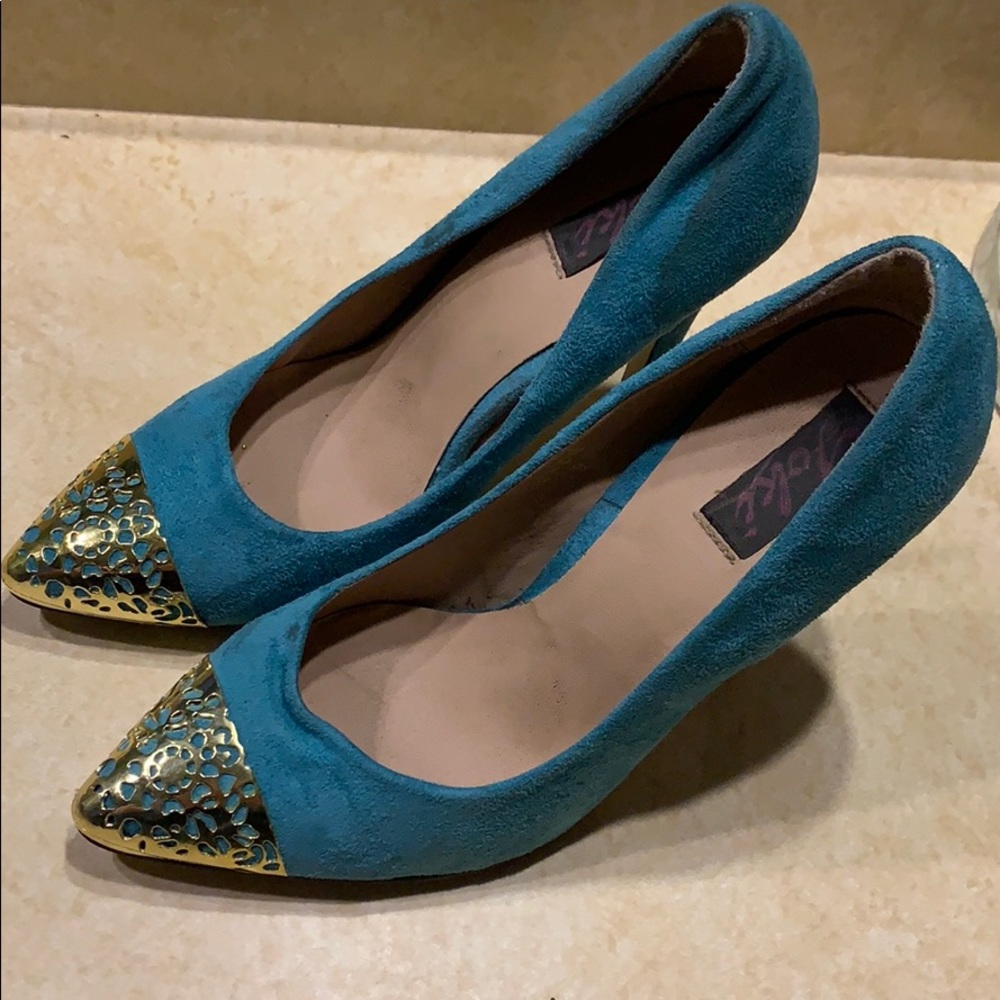 Turquoise suede. Gold tipped stilettos